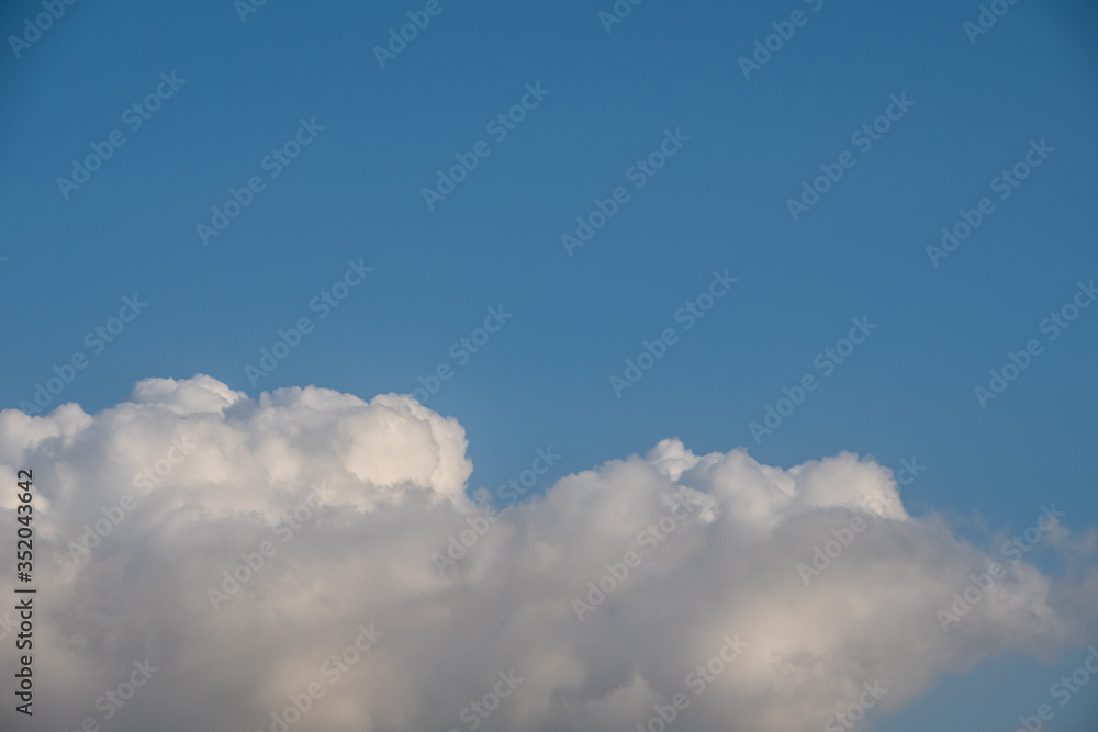 Sunny cloudscape blue sky with white cumulus clouds cloudscape. Beautiful nature background backdrop sky. - obrazy, fototapety, plakaty 
