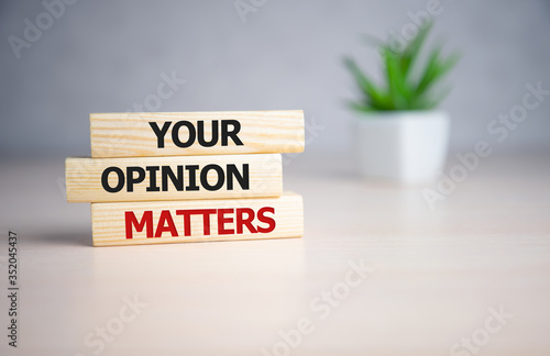 Your opinion matters - words from wooden blocks with letters, Your feedback is important concept, top view. photo