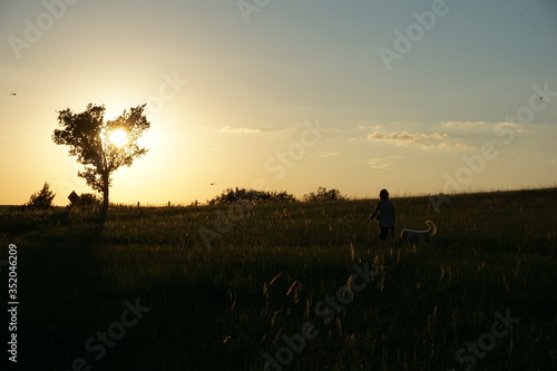 silhouette of a man walking on a sunset