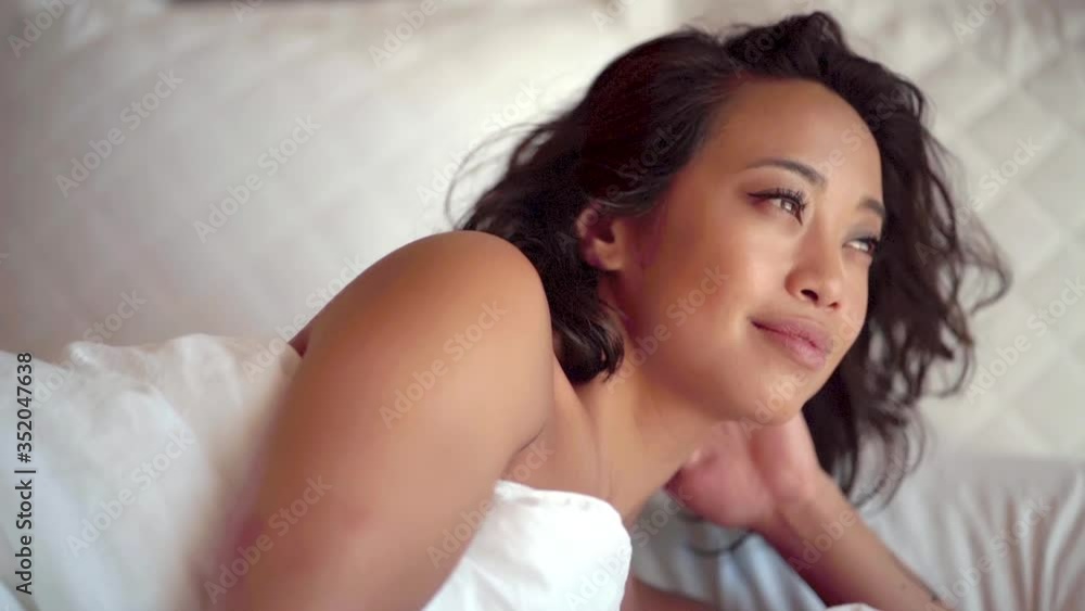 Woman on vacation wakes up refreshed taking in the incredible view Woman on vacation wakes up refreshed taking in the incredible view