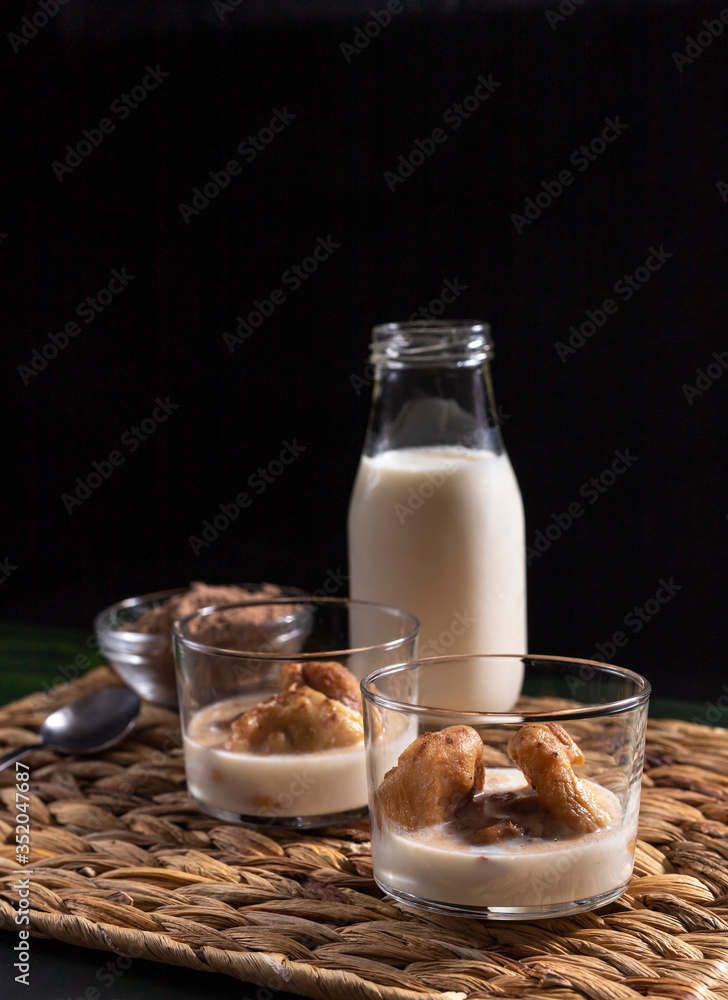 eggs of milk, typical dessert of Extremadura, fried dough with milk, cinnamon and cocoa sprinkled eggs of milk, typical dessert of Extremadura, fried dough with milk, cinnamon and cocoa sprinkled
