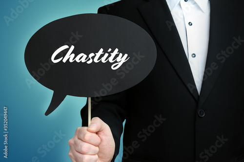 Chastity. Lawyer (Man) holds the sign of a speech bubble in his hand. Text on the label. Symbol of law, justice, judgement photo