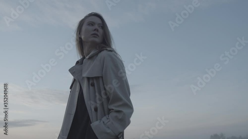 Girl at sunrise in a field with fog