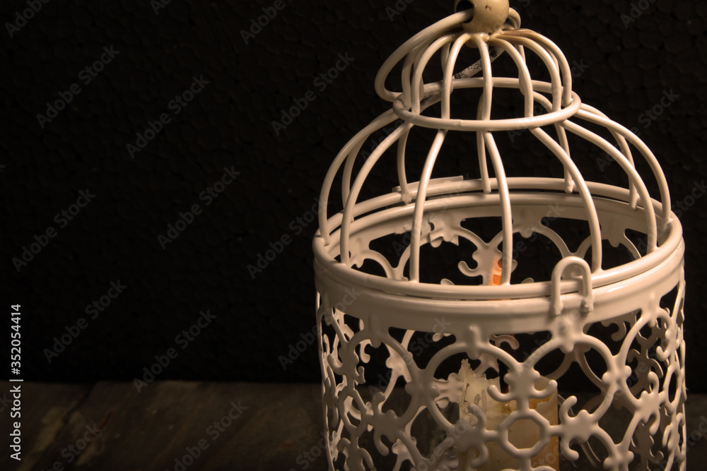 Close up shot of candle lantern on a rustic wooden table Close up shot of candle lantern on a rustic wooden table