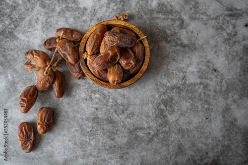 Date in wooden small plate and on table top view