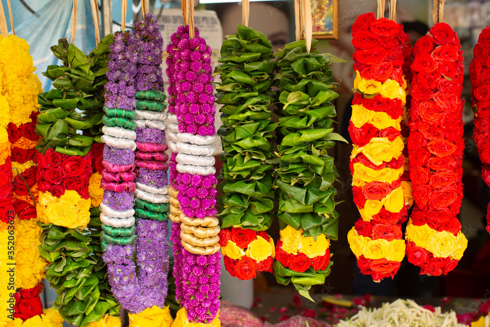 Flower garlands for sale at outdoor market