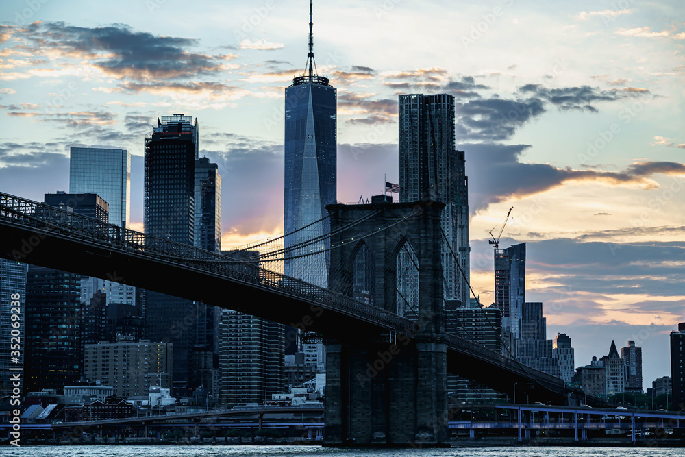 New York night panorama. Brooklyn Bridge and New York City skyline. Manhattan skyline. Skyscrapers buildings. New York City night lights. New York night panorama. Brooklyn Bridge and New York City skyline. Manhattan skyline. Skyscrapers buildings. New York City night lights.