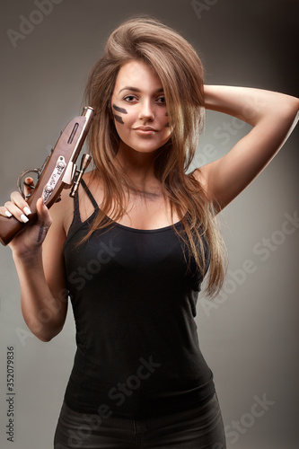 Girl with two old gun in the hands