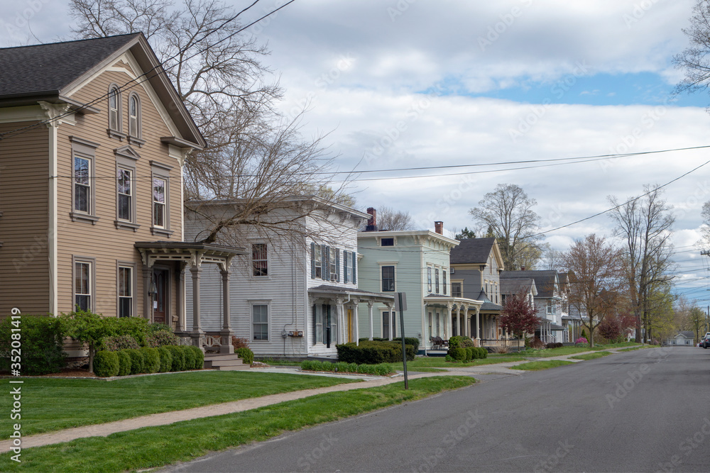 day sky and street with suburban homes day sky and street with suburban homes