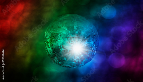 Party disco mirror ball reflecting purple lights