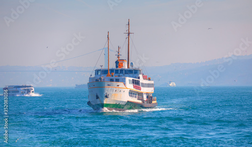 Water trail foaming behind a passenger ferry boat in Bosphorus  Istanbul  Turkey
