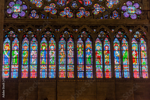 Stained patterns on glass of the window in the Notre-Dame de Paris before the big fire, a medieval Catholic cathedral on the Ile de la Cite in the 4th arrondissement of Paris