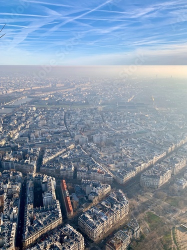 aerial view of the city Paris sky clouds cloud blue sun air nature sunset view, high above, space, sunrise, heaven, weather cloudscape fly flight aerial white horizont atmosphere beauti
