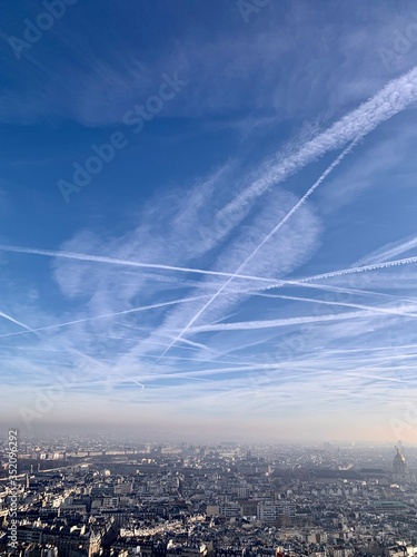 aerial view of the city Paris sky clouds cloud blue sun air nature sunset view, high above, space, sunrise, heaven, weather cloudscape fly flight aerial white horizont view of the city 