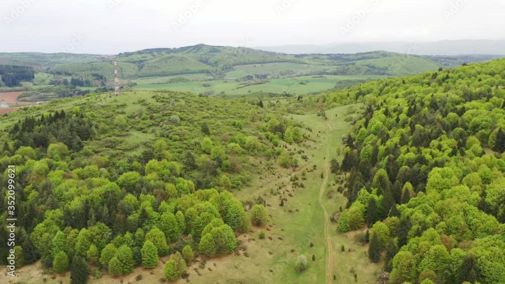 Spring aerial view of hills, BTS tower and mixed forest in central Slovakia Spring aerial view of hills, BTS tower and mixed forest in central Slovakia
