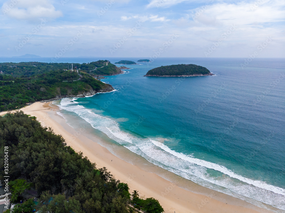 Aerial view of quiet Naiharn beach in Phuket Thailand during locked down policy due to Covid-19. All beaches in Phuket are not allowed to enter.