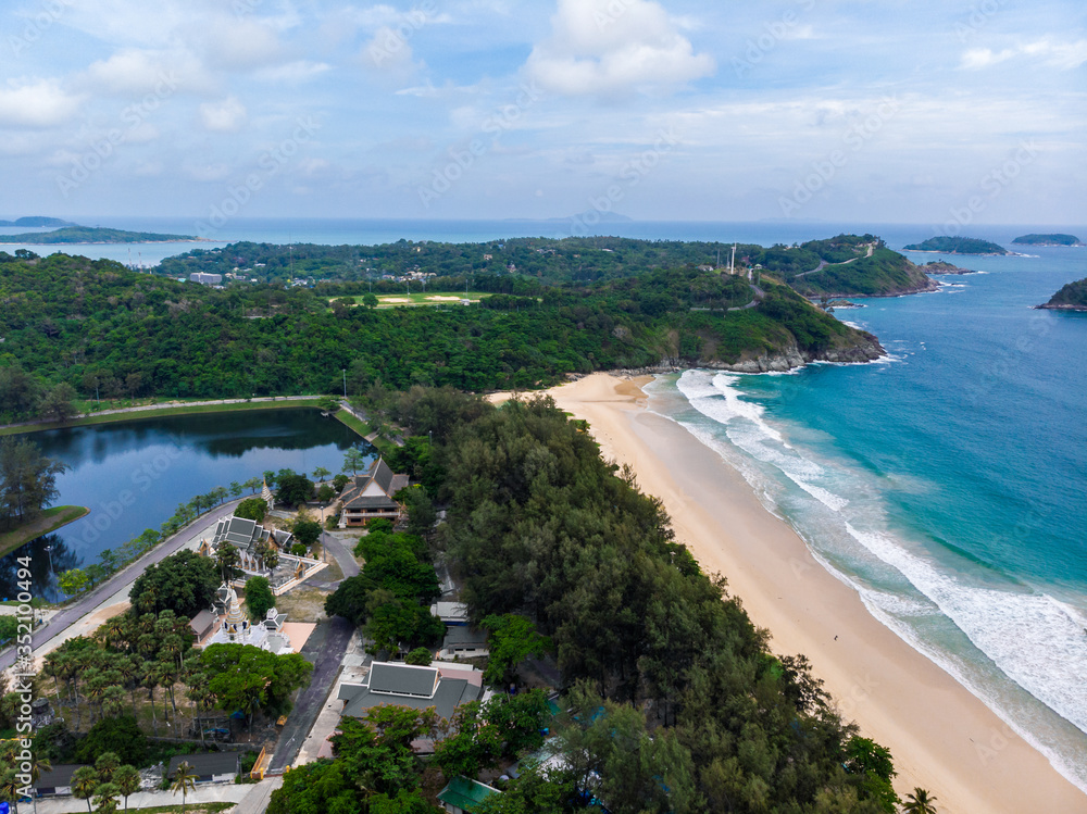 Aerial view of quiet Naiharn beach in Phuket Thailand during locked down policy due to Covid-19. All beaches in Phuket are not allowed to enter.