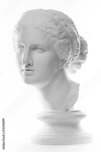 Gypsum copy of ancient statue Venus head isolated on white background. Plaster sculpture woman face.
