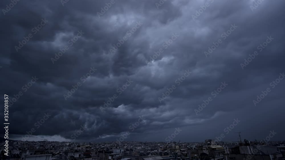 Dark clouds floating over the city, timelapse