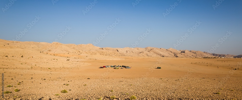 Oman. Circa April, 2019. A group of four wheel drive SUV cars set up a camp for overnight stay in the desert.