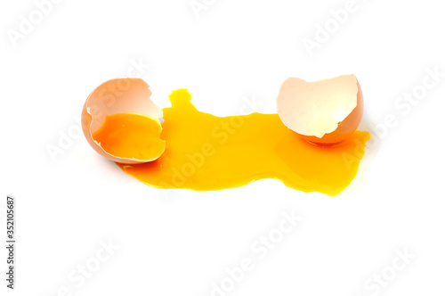 Broken chicken egg isolated on a white background