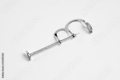 Cherry Pitter. Cherry and olive stoner on a white background. A tool for removing cores from fruit.High-resolution photo.