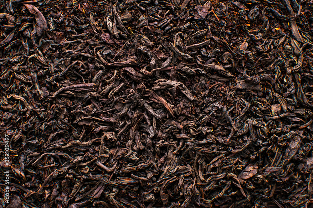 Black tea loose dried tea leaves, marco. Close-up tea leaves. Black tea loose dried tea leaves, marco. Close-up tea leaves.