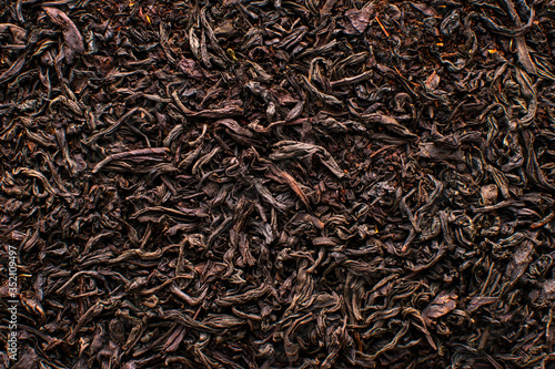 Black tea loose dried tea leaves, marco. Close-up tea leaves.
