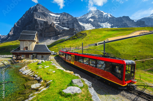 Cogwheel tourist train coming down from the mountain, Jungfraujoch, Switzerland photo