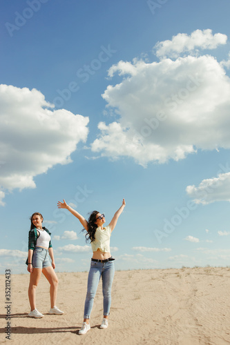 Traveling, camping, open air party. Female friends enjoying vacation together. Freedom, sightseeing friendship