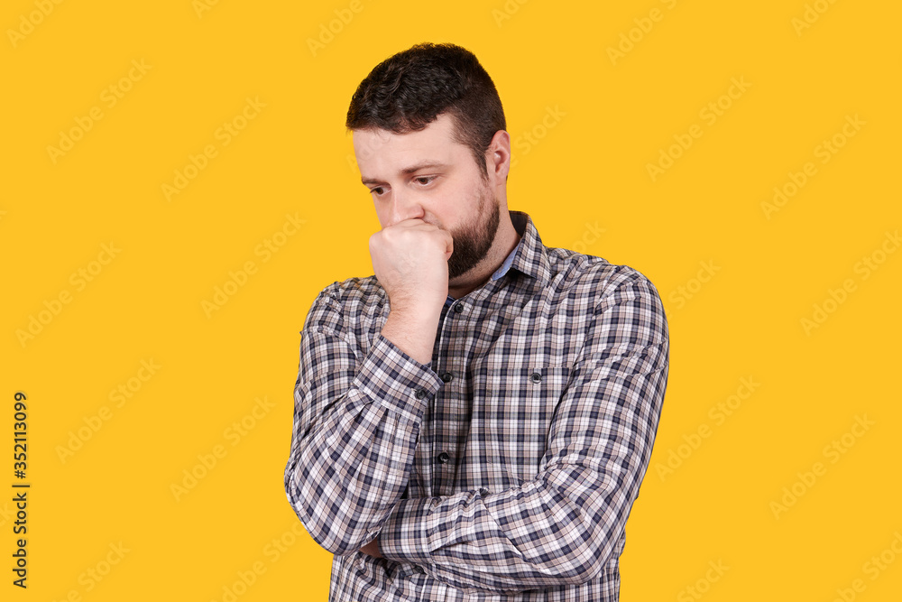 Man with beard holding his head with hand, panic, isolated on orange background. Man with beard holding his head with hand, panic, isolated on orange background.