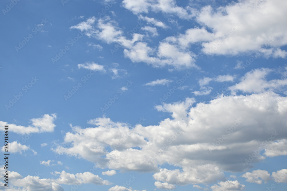 White fluffy clouds on the blue sky, nature background. White fluffy clouds on the blue sky, nature background.
