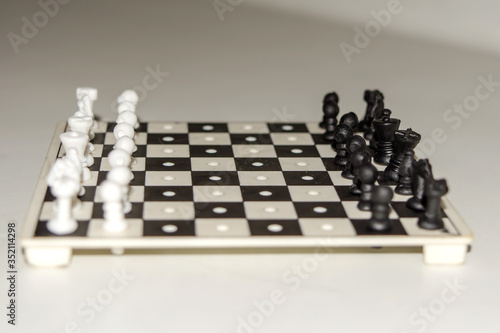 Chess board with figures on isolate white background. 