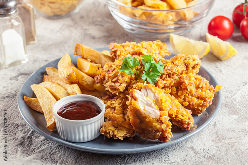 Tableau sur toile Chicken strips in cornflakes breadcrumb