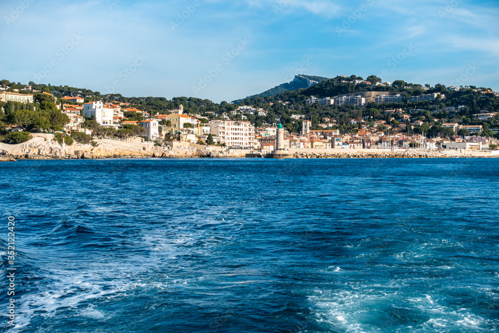 The town of Cassis seen from a boat in a beautiful sunny day, France