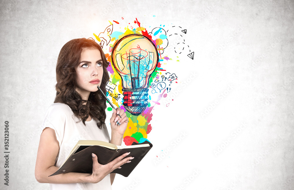 Pensive young woman with notebook, business idea Pensive young woman with notebook, business idea