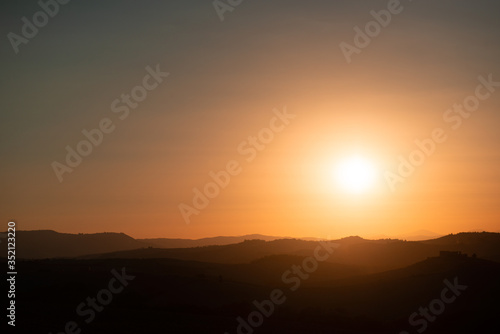 Amazing lanscape Tuscany at sun set, Italy, summer outdoor. Hills and evening sun