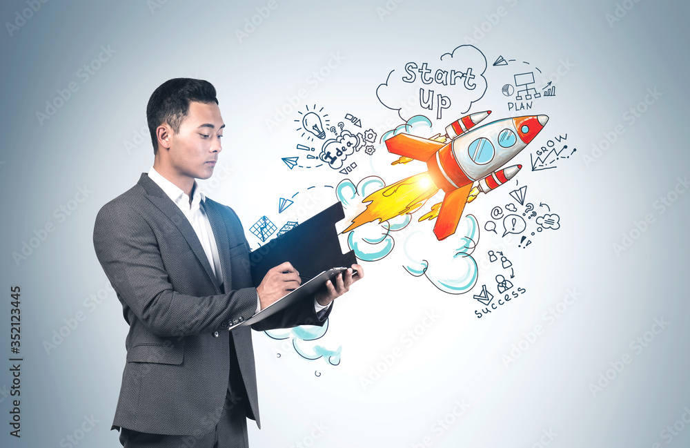 Asian businessman with clipboard, startup sketch Asian businessman with clipboard, startup sketch