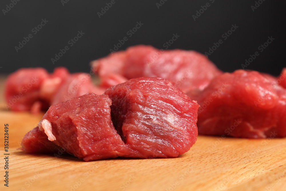 Diced beef casserole steak on cutting board Diced beef casserole steak on cutting board