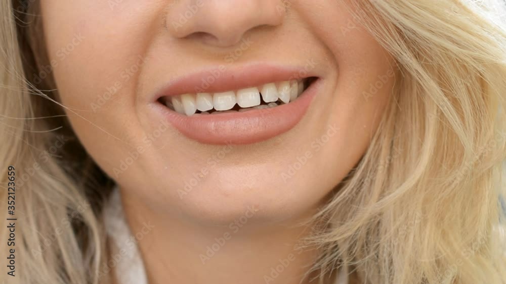 closeup blonde hair woman smiling wide with beautiful lips hd closeup blonde hair woman smiling wide with beautiful lips hd