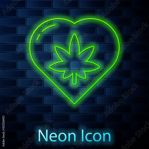 Glowing neon line Marijuana leaf in heart shape icon isolated on brick wall background. Hemp symbol. Vector