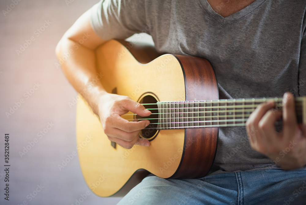 Fototapeta musician man playing acoustic guitar