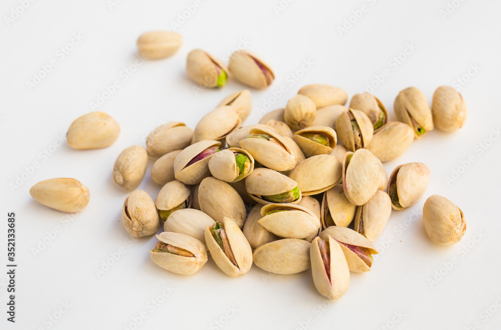 roasted pistachios on white background roasted pistachios on white background