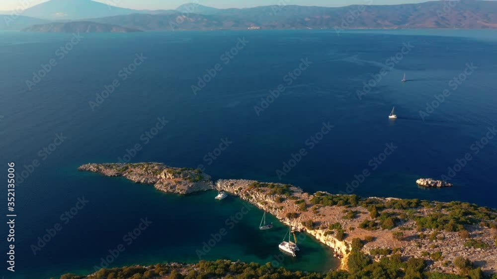 Catamarans and yachts anchored in the bay of the Greek Catamarans and yachts anchored in the bay of the Greek