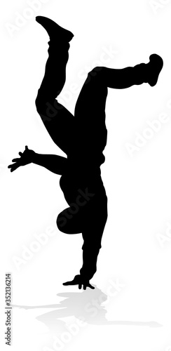 A male street dance hip hop dancer in silhouette