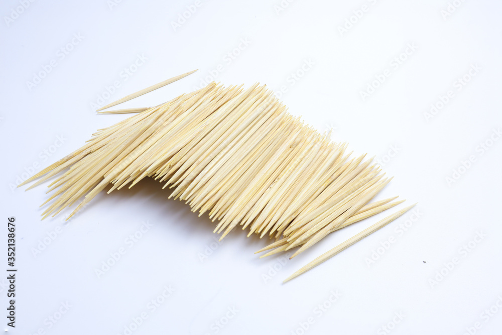 A pile of toothpicks on a white background A pile of toothpicks on a white background