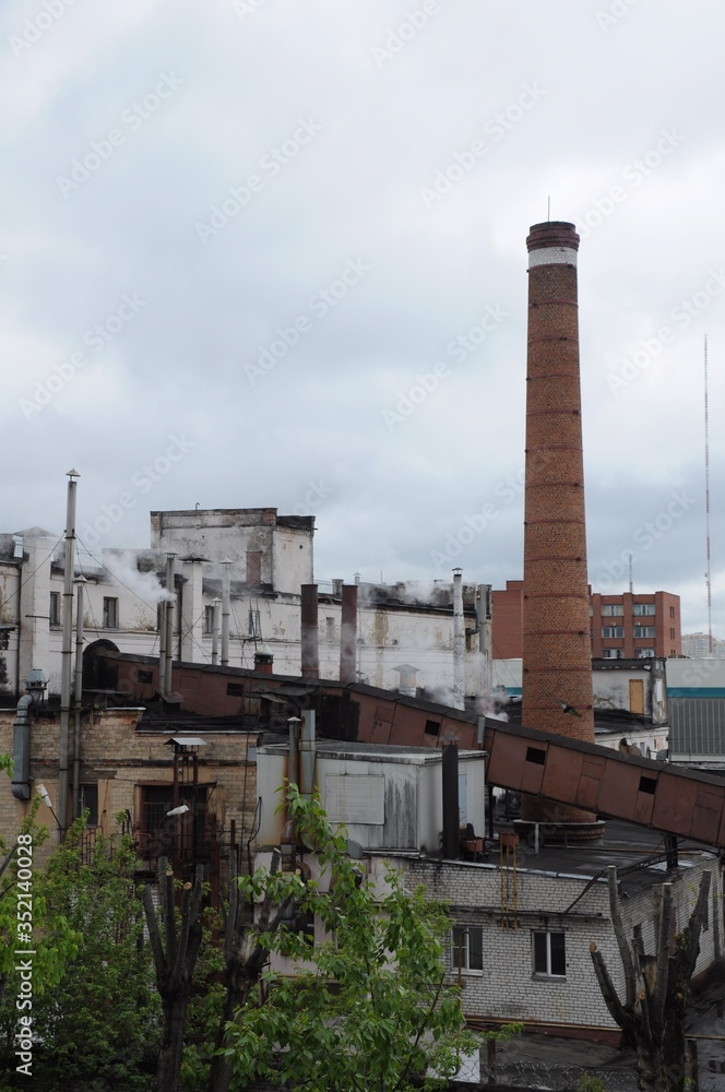 Many smoking chimneys and factory buildings