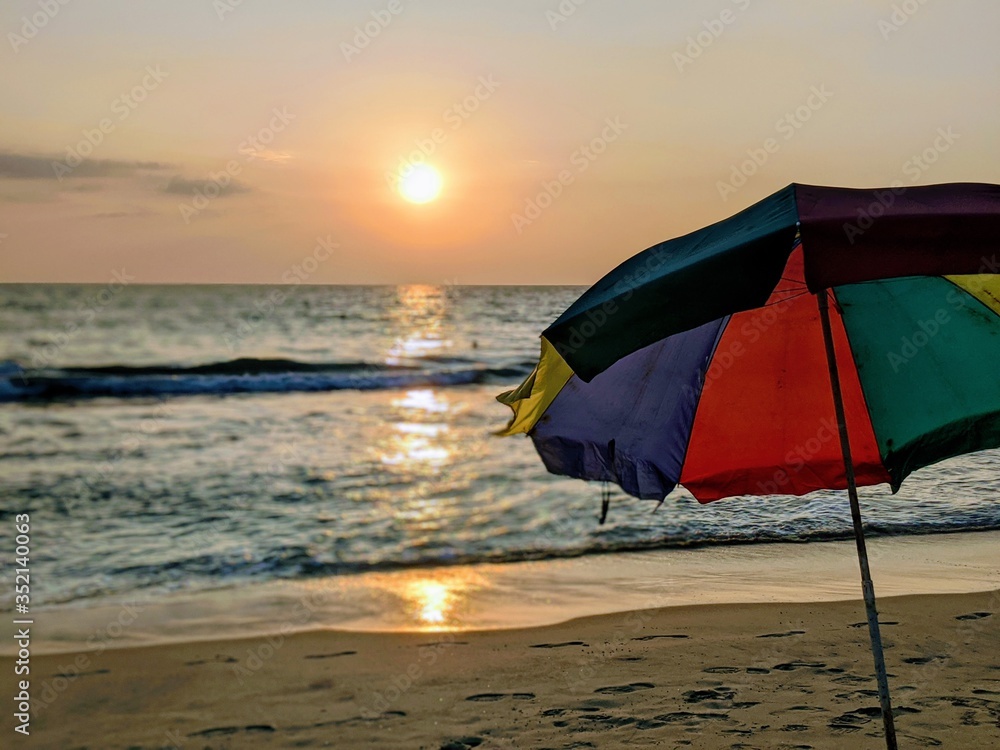 Beach umbrella sunset 