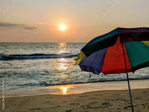Beach umbrella sunset 