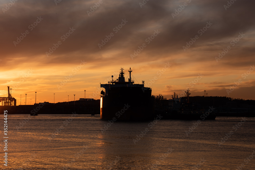 Silhouette of an oil tanker at sunset Silhouette of an oil tanker at sunset